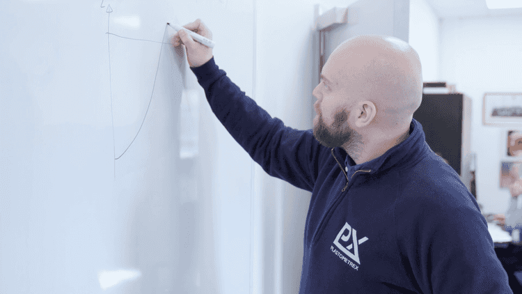 Jimmy Campbell writing on white board